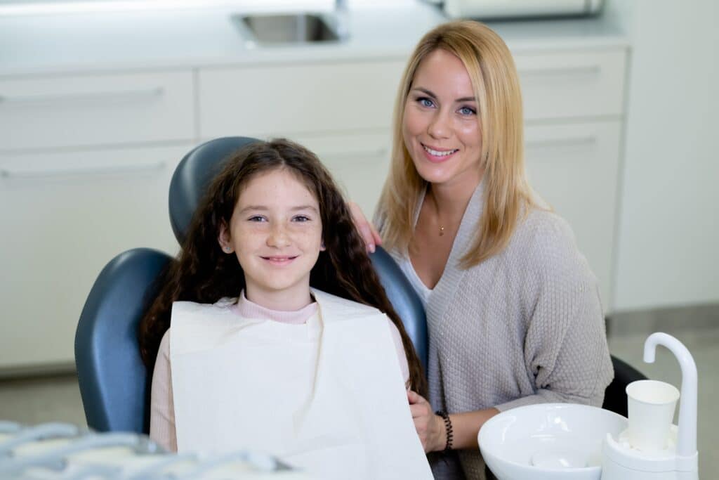 Middle,Shot,Of,A,Smiling,Caucasian,Daughter,And,Mother,At